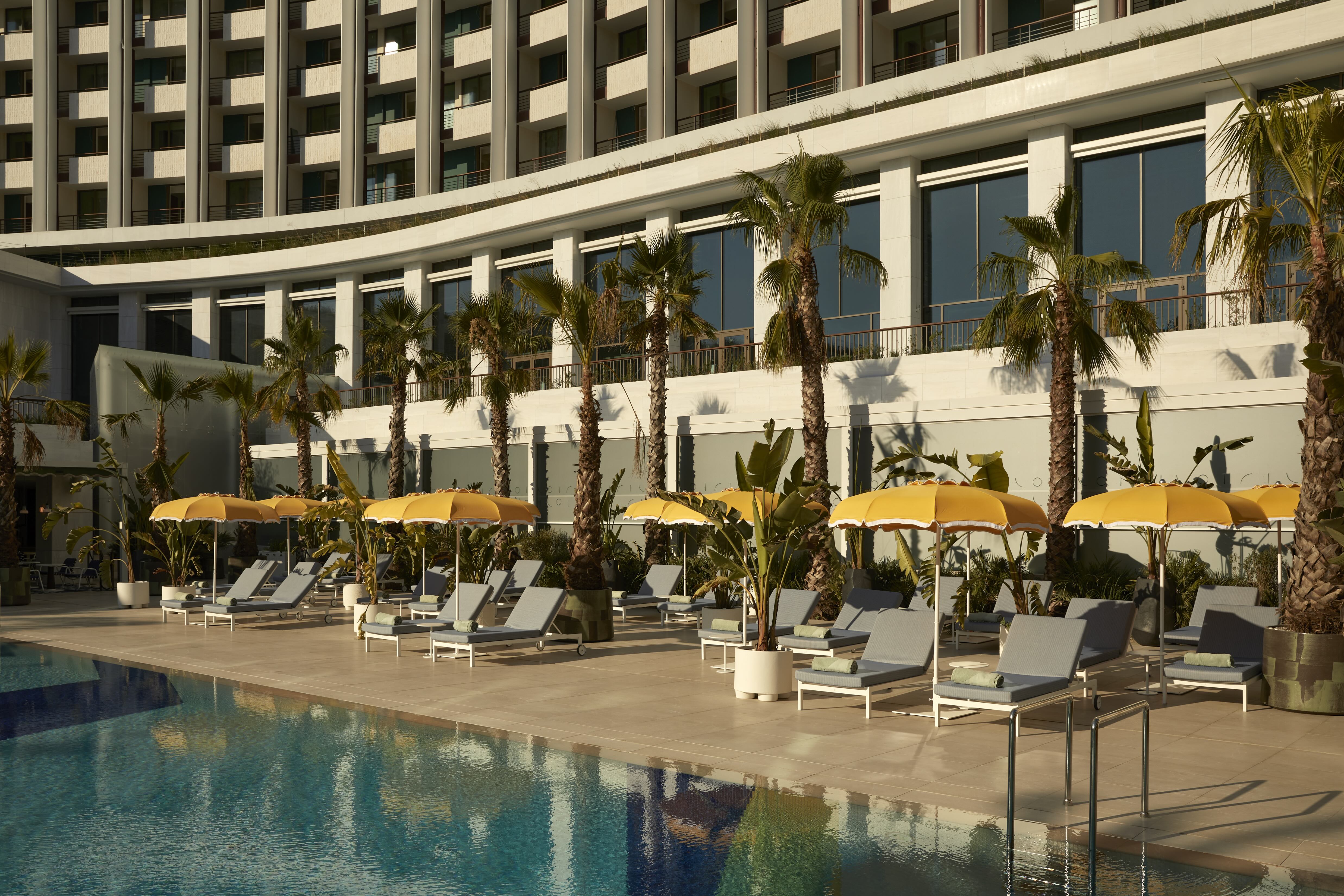image of the property's Outdoor Pool, the city’s largest outdoor pool, image courtesy of Conrad Athens The Ilisian